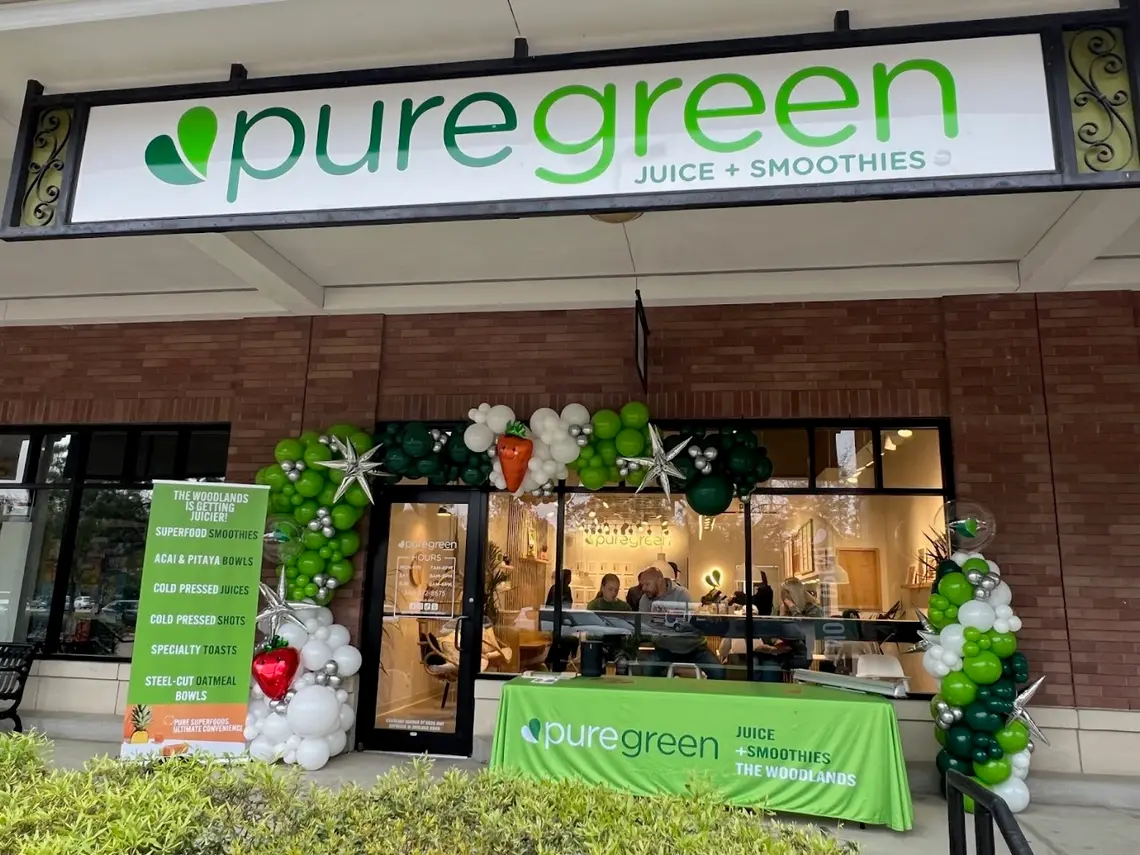 The shopfront of Pure Green The Woodlands on Research Forest Drive