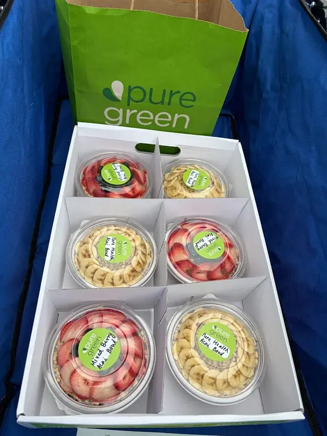 A catering box of acai bowls from Pure Green Naperville