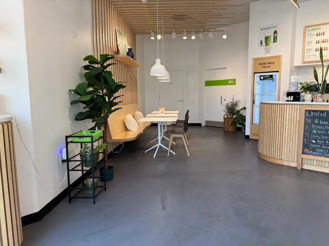 Bench seating, tables and the online order fridge inside Pure Green Bridgewater
