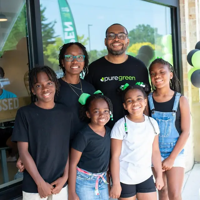 Team and young guests at Pure Green Carytown Exchange