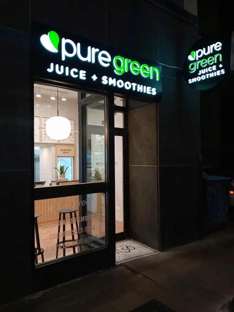 Pure Green Gold Coast storefront lit up on North State Street in Chicago