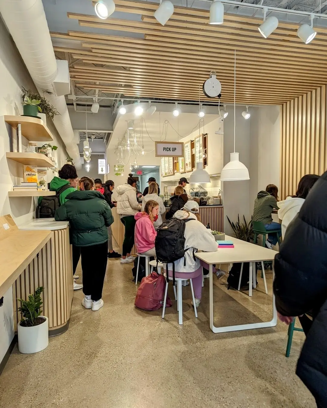 Guests seated inside the Pure Green Madison juice bar