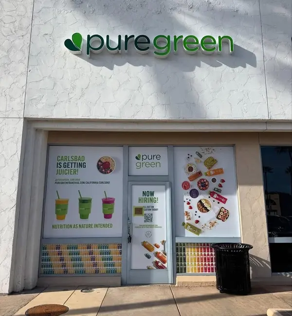 Pure Green Carlsbad storefront with cold-pressed juice and smoothie window graphics