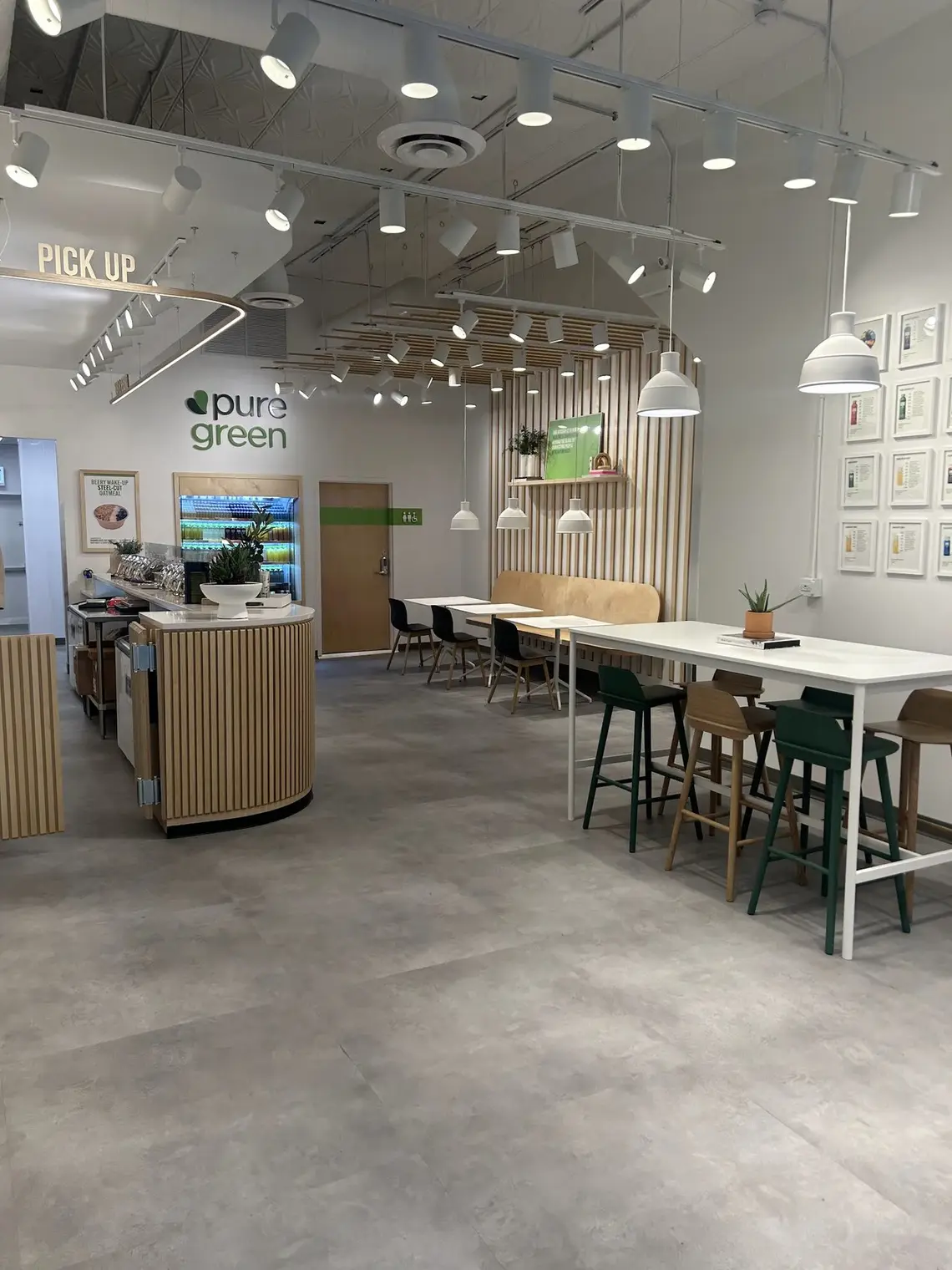 The pickup counter and communal table inside Pure Green River North
