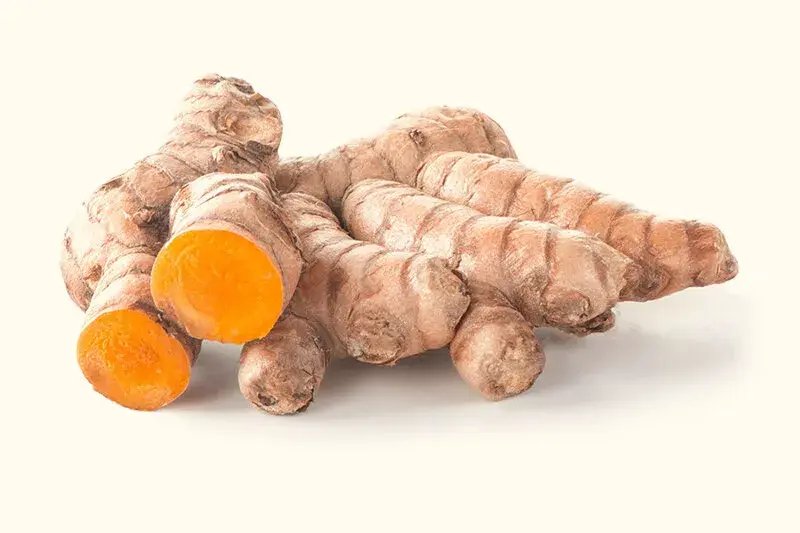 Fresh orange turmeric pieces