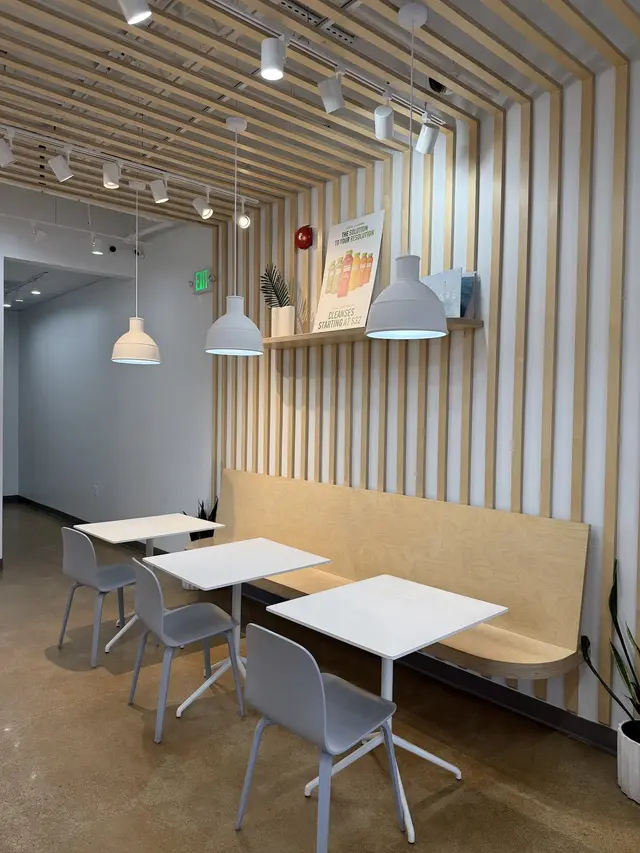 Banquette seating and tables inside Pure Green Columbia