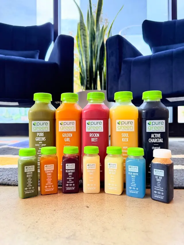 Bottles of cold-pressed juice and wellness shots lined up at Pure Green Westerville