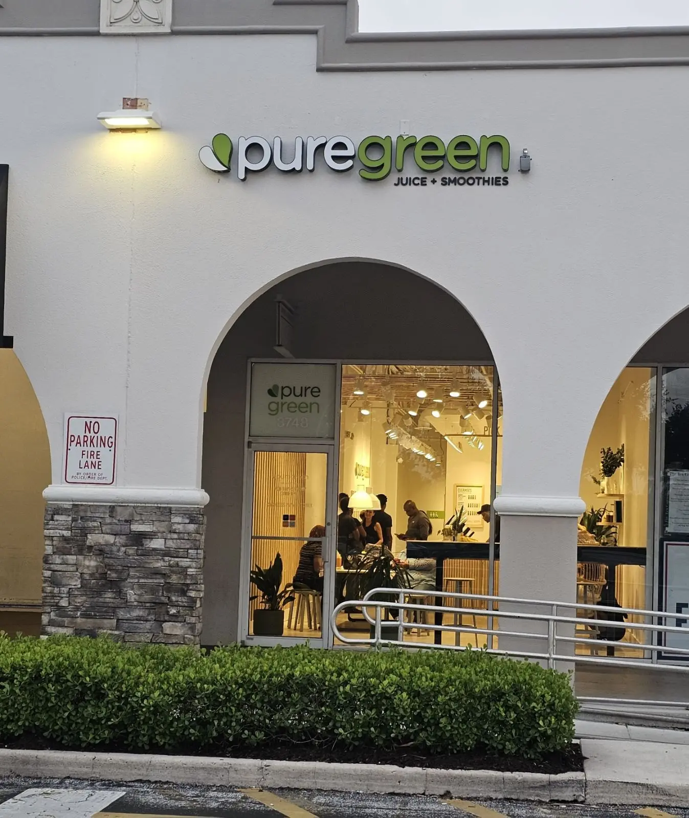 Pure Green Deerfield storefront and arched entry on West Hillsboro Boulevard