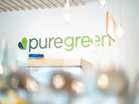 Pure Green brand signage on the wall inside the Fulton Market location