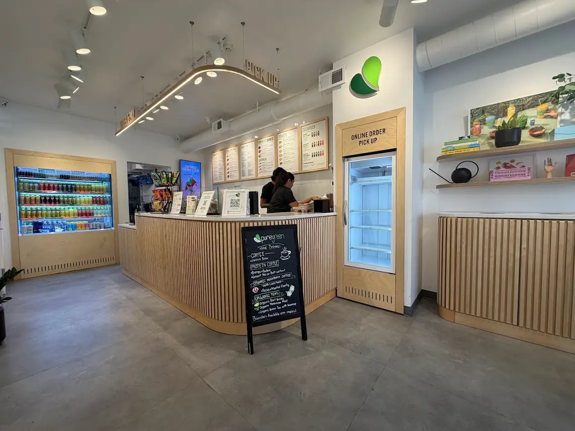 The order counter, juice fridge and online order pickup at Pure Green Hoboken