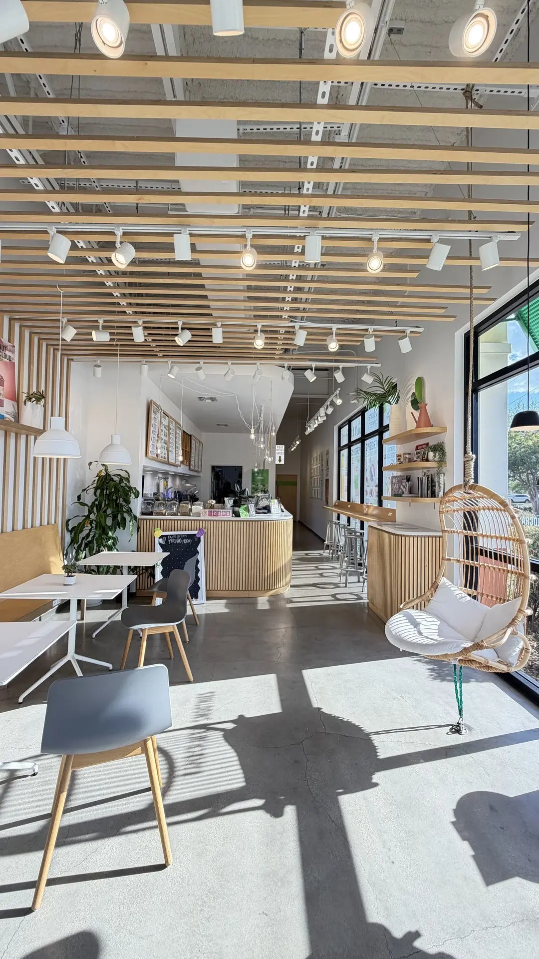 Inside Pure Green Cape Coral with modern seating and a communal table