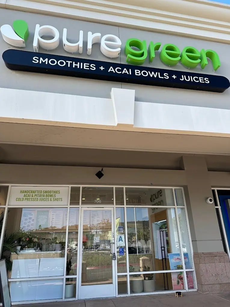 Pure Green Carmel Valley storefront at suite 706 with the smoothies, acai bowls and juices sign
