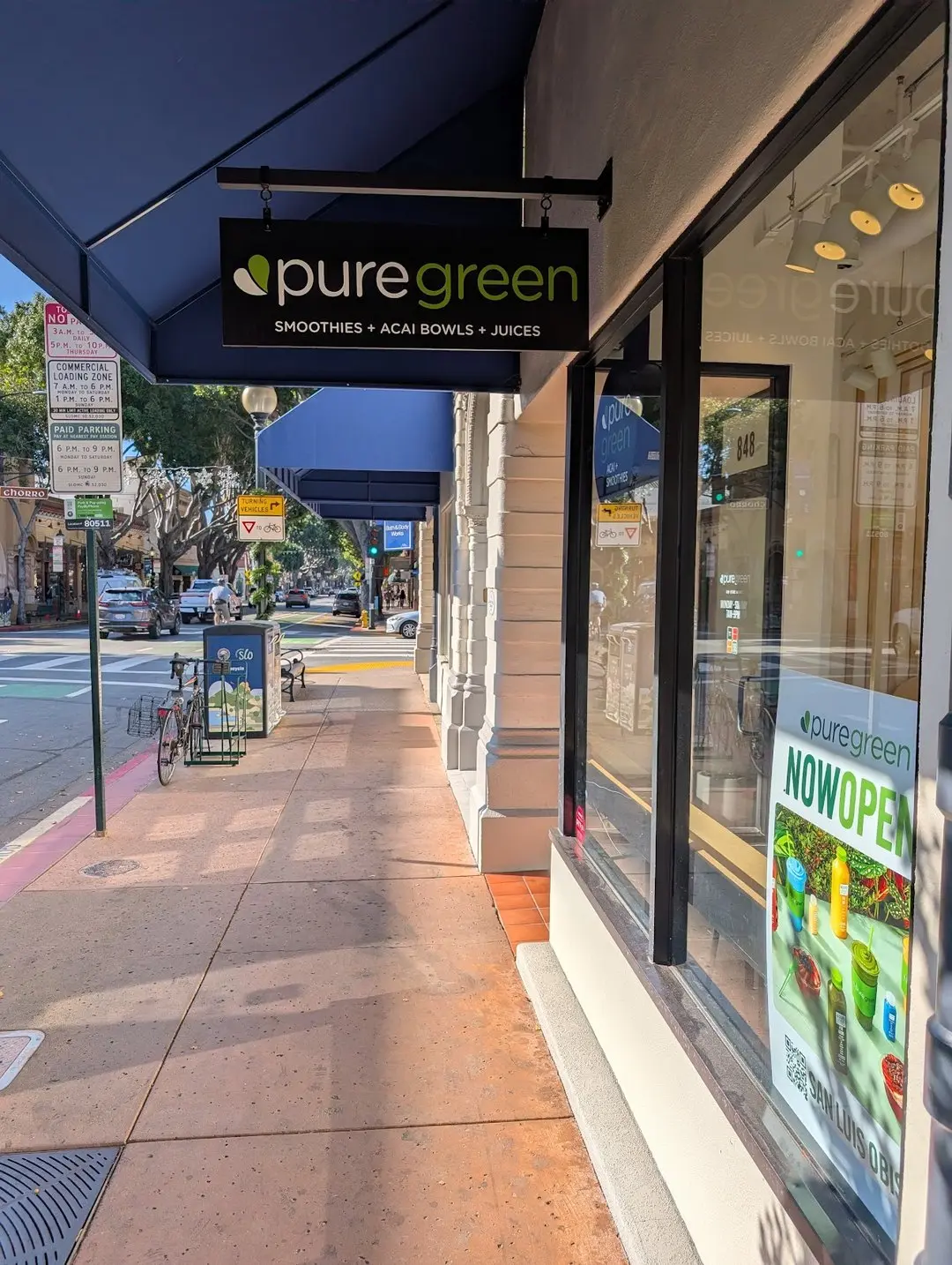 Pure Green SLO storefront blade sign on Higuera Street in downtown San Luis Obispo