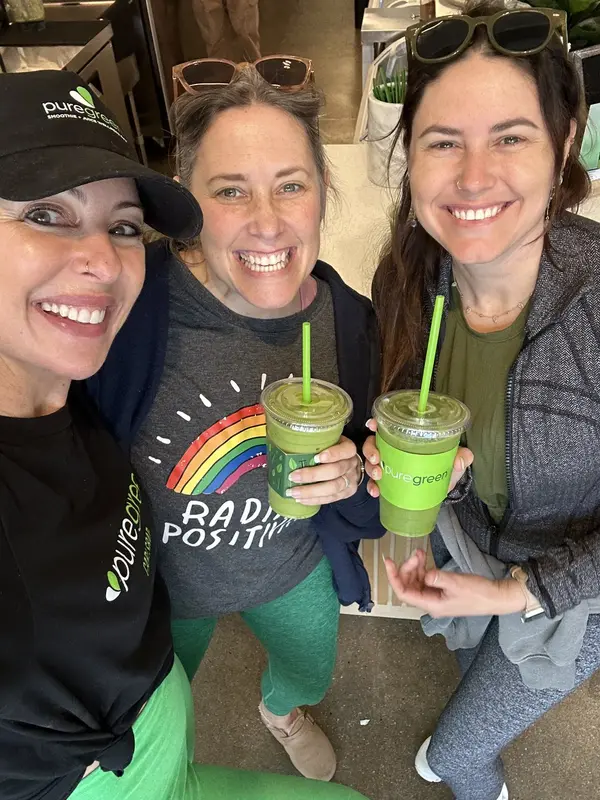 Pure Green Carlsbad team members with fresh green smoothies