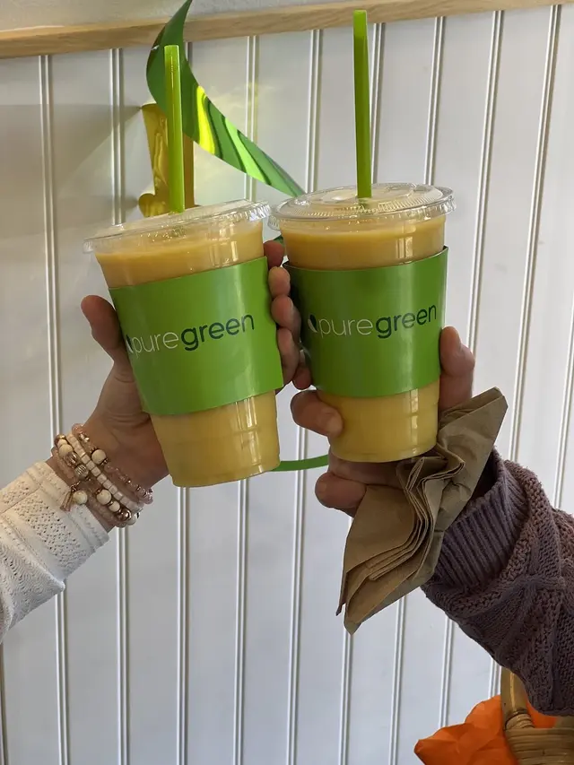 Two green smoothies toasted at Pure Green Vienna