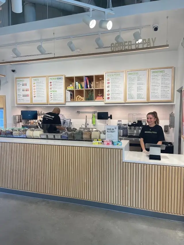 Pure Green Bethesda team members behind the counter