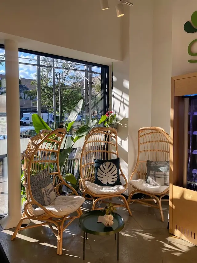 The seating area with rattan chairs at Pure Green Washington Heights