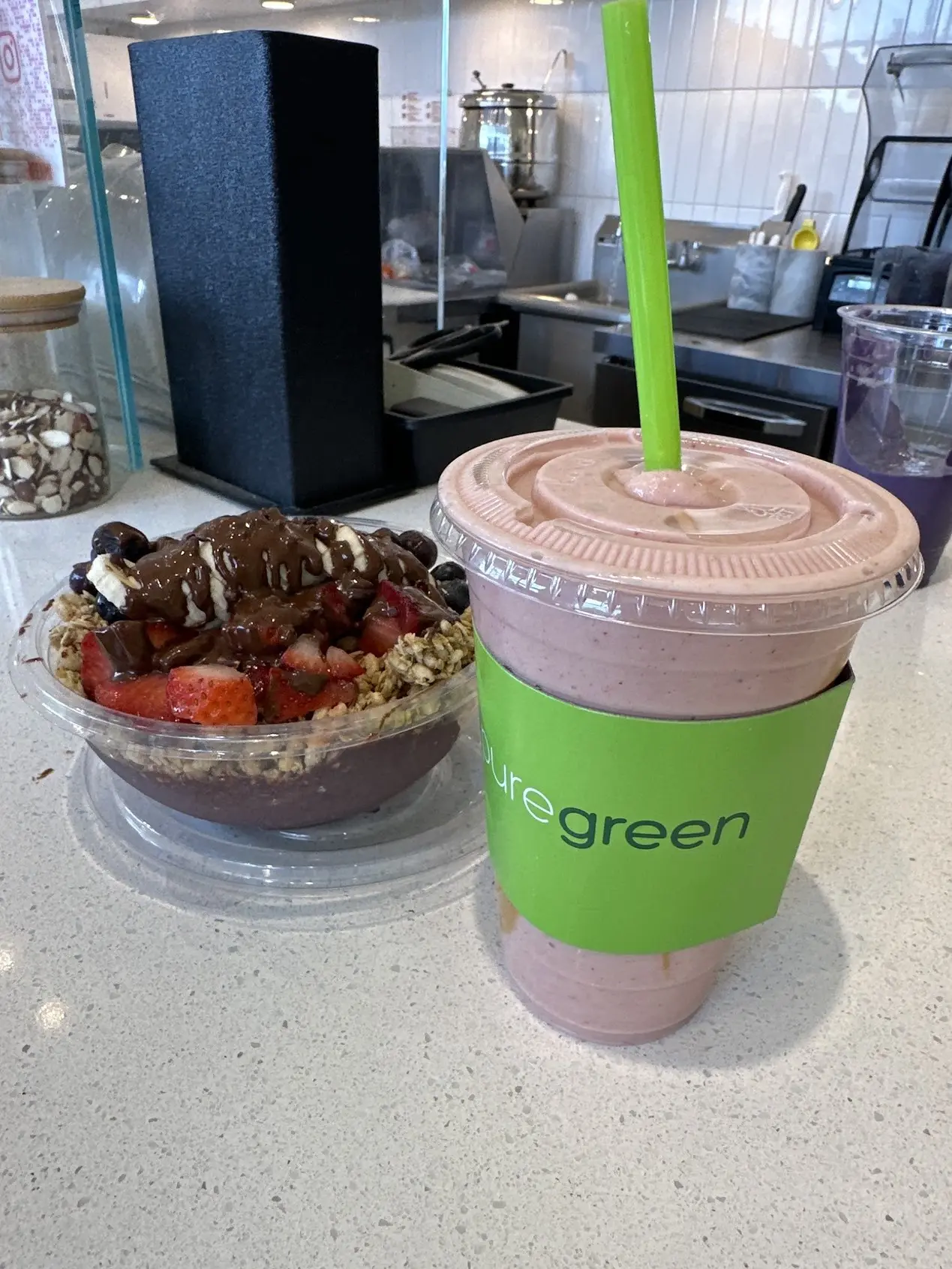An acai bowl and a smoothie on the counter at Pure Green Downtown Rochester