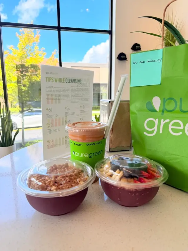 Acai bowls, a smoothie and a Pure Green bag on the table at Pure Green Westerville