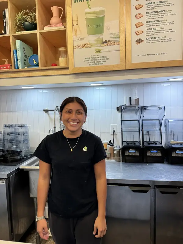 Pure Green Mizner Park team member behind the counter