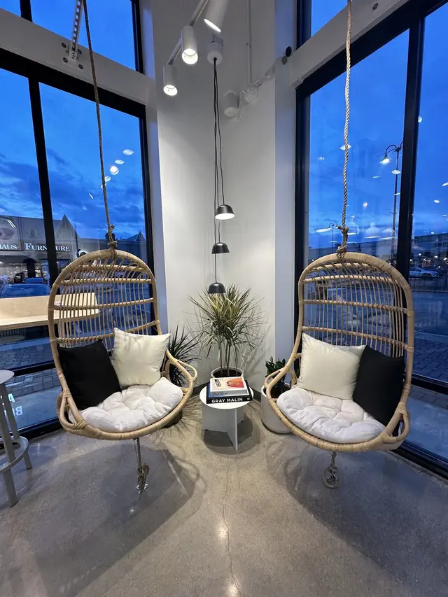 Hanging chairs by the windows inside Pure Green South Barrington