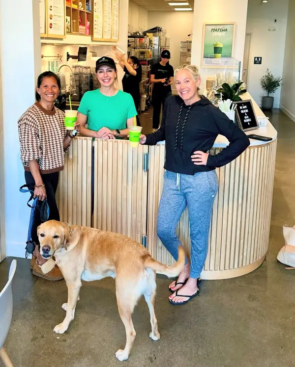 Guests and a friendly dog at the counter inside Pure Green Carlsbad