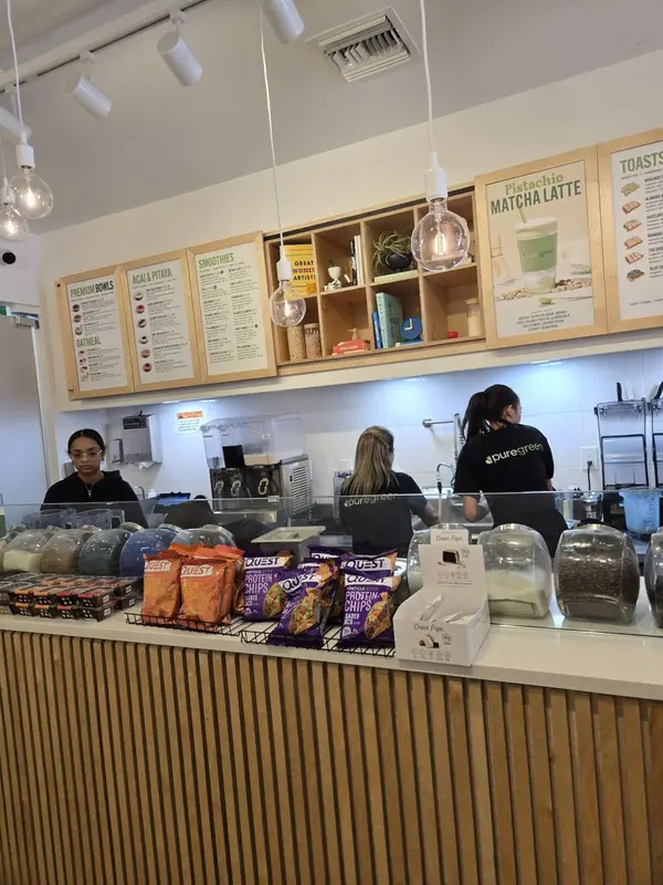 Guests ordering at the counter inside Pure Green Mizner Park