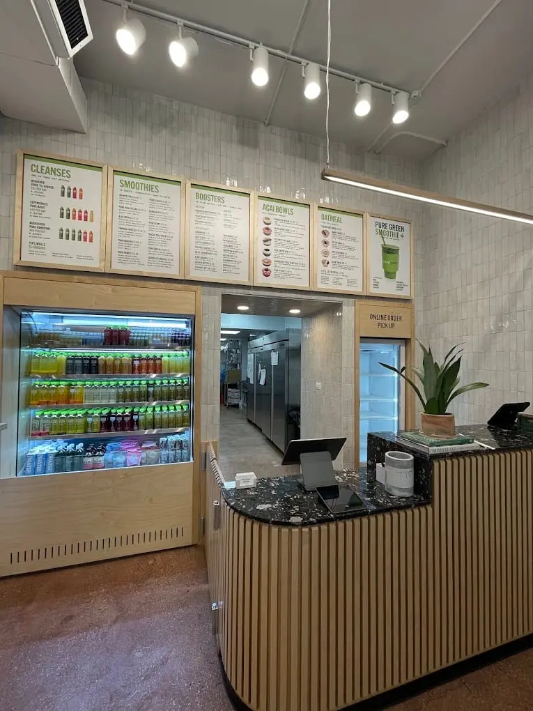 Order counter, menu boards and juice fridge inside Pure Green Gold Coast