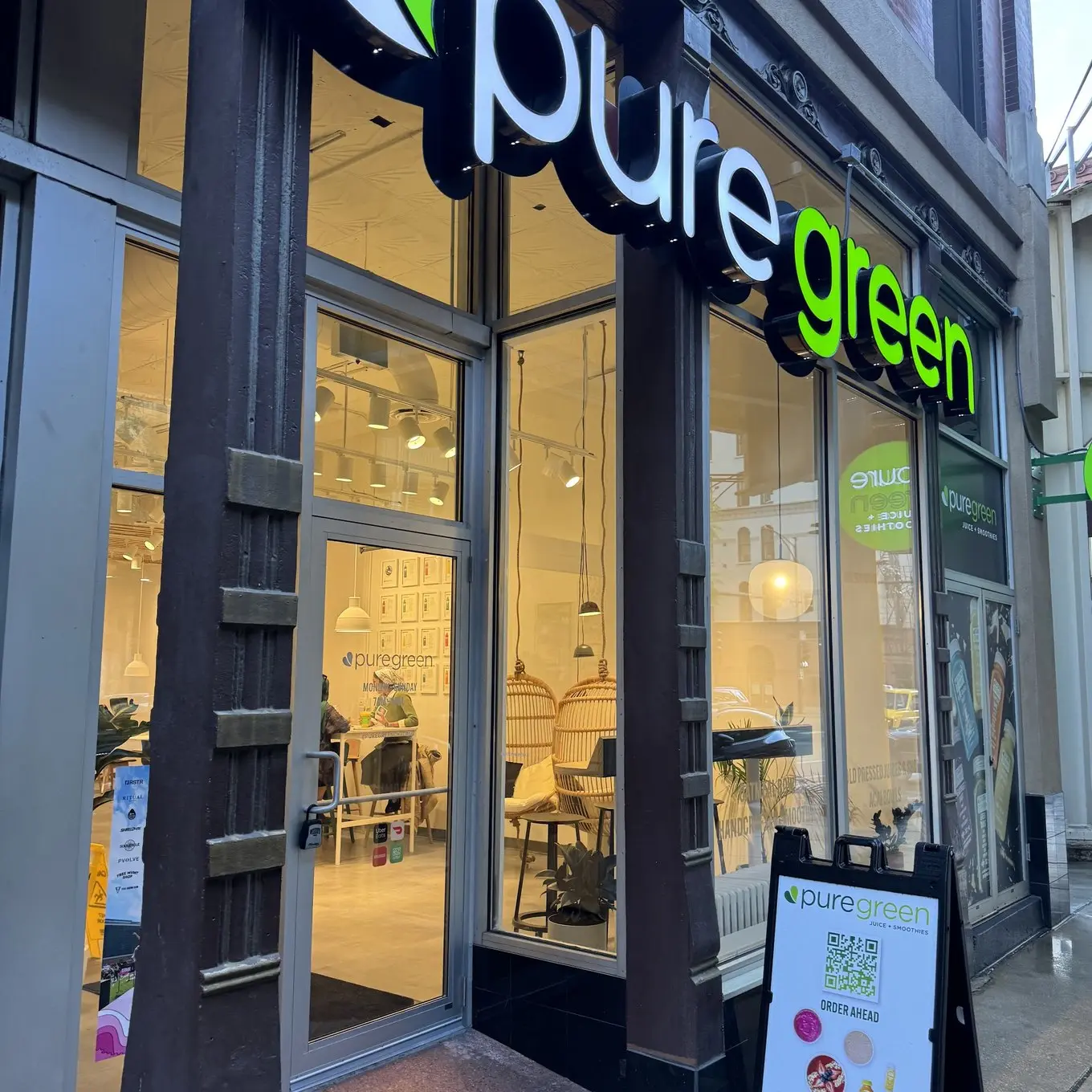 Pure Green River North storefront and lit sign on North Wells Street in Chicago