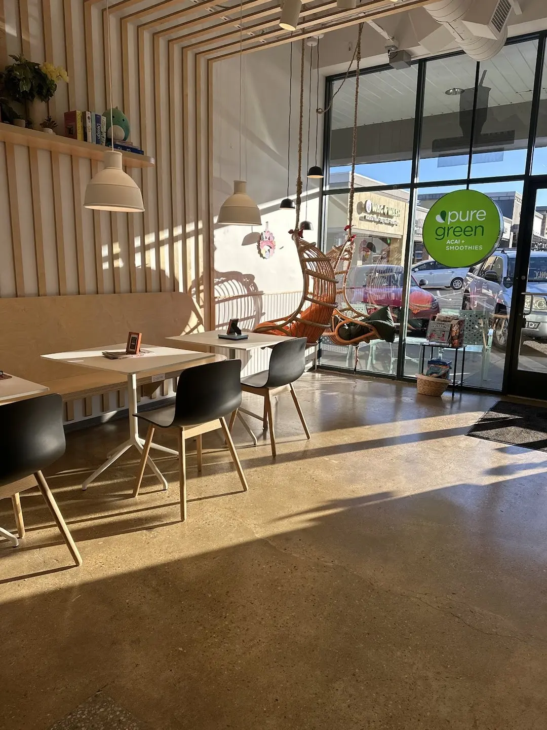 Seating area and hanging chair inside Pure Green Vienna