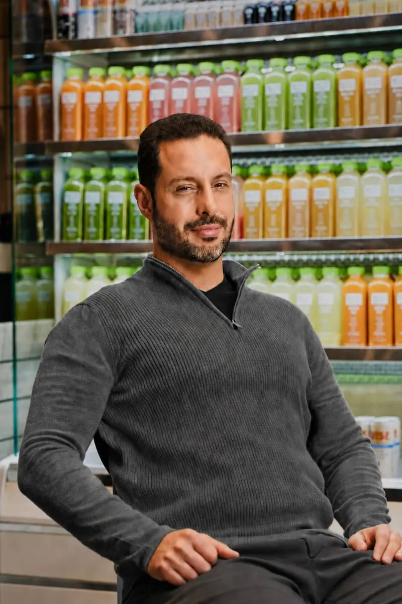 Ross Franklin, Founder and CEO of Pure Green Franchise, inside a Pure Green store