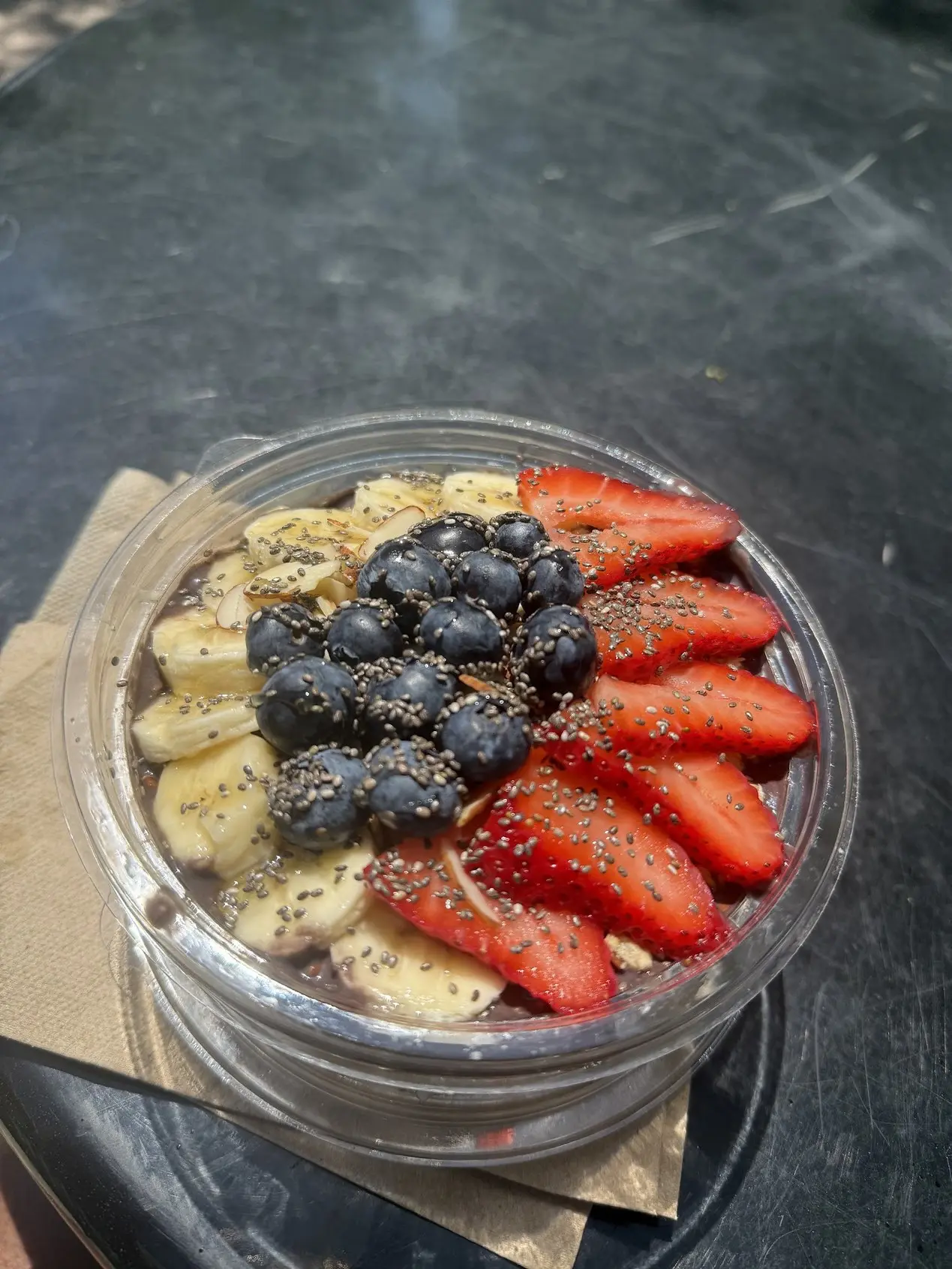 An acai bowl with banana, blueberries and strawberries at Pure Green Fishers