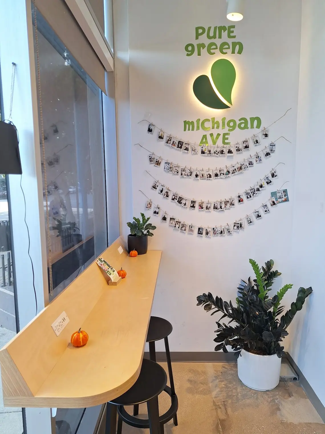 The window counter and Michigan Ave wall art inside Pure Green South Michigan Ave