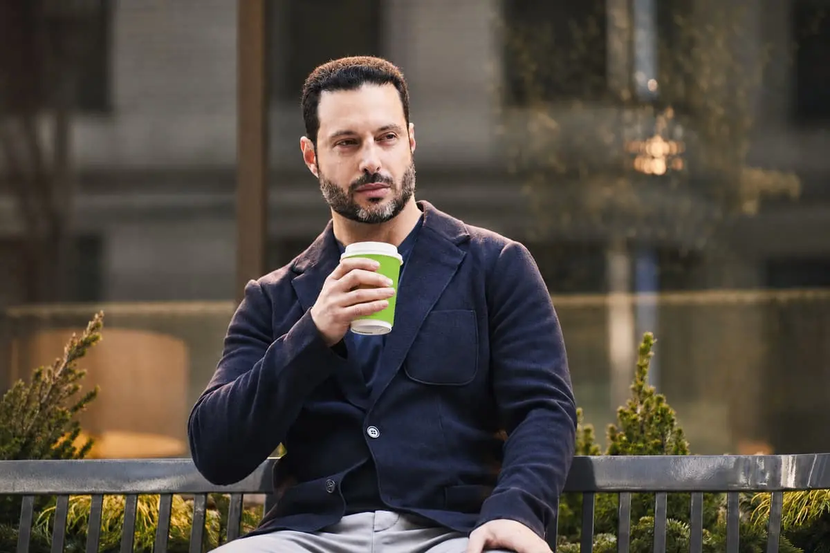 Ross Franklin, Founder and CEO of Pure Green, holding a green cup in New York City