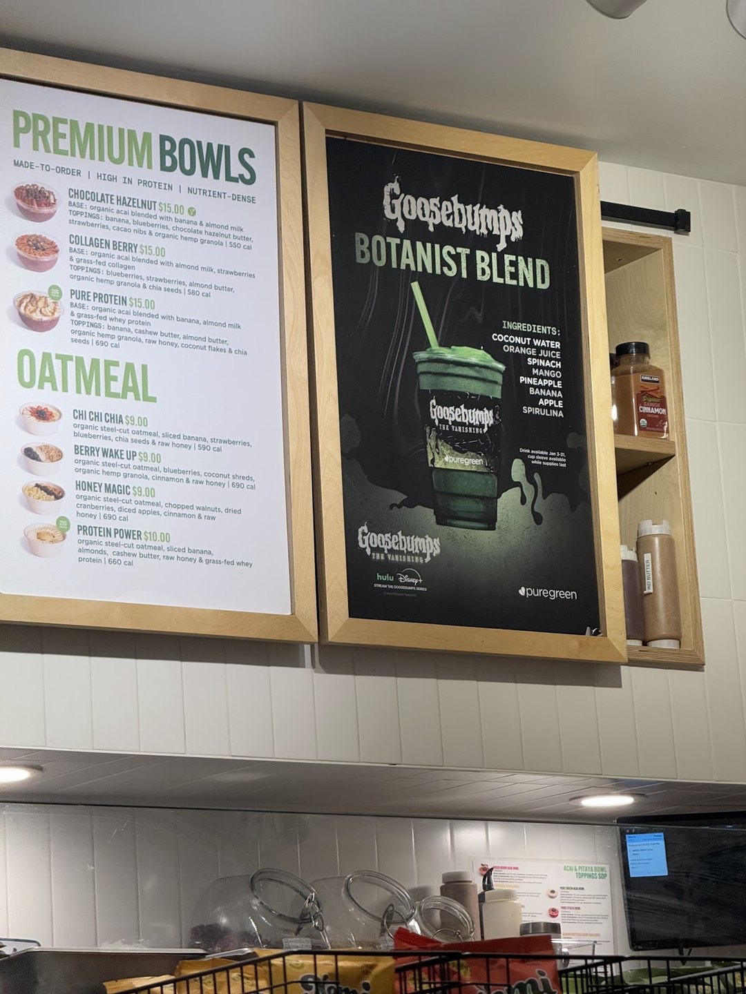 Menu boards for premium acai bowls and oatmeal at Pure Green Fulton Market
