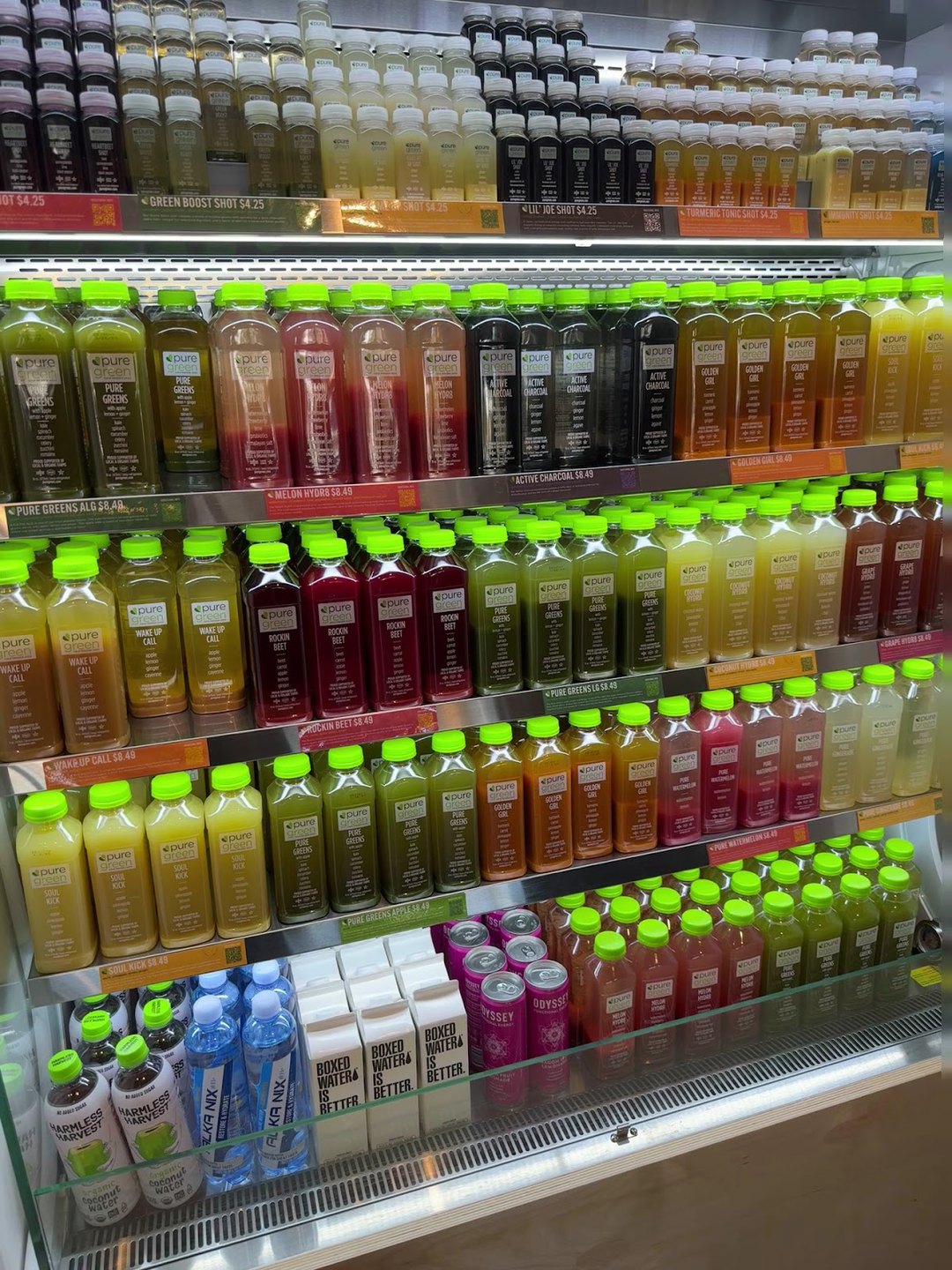 Cold-pressed juice fridge fully stocked at Pure Green Mission Viejo