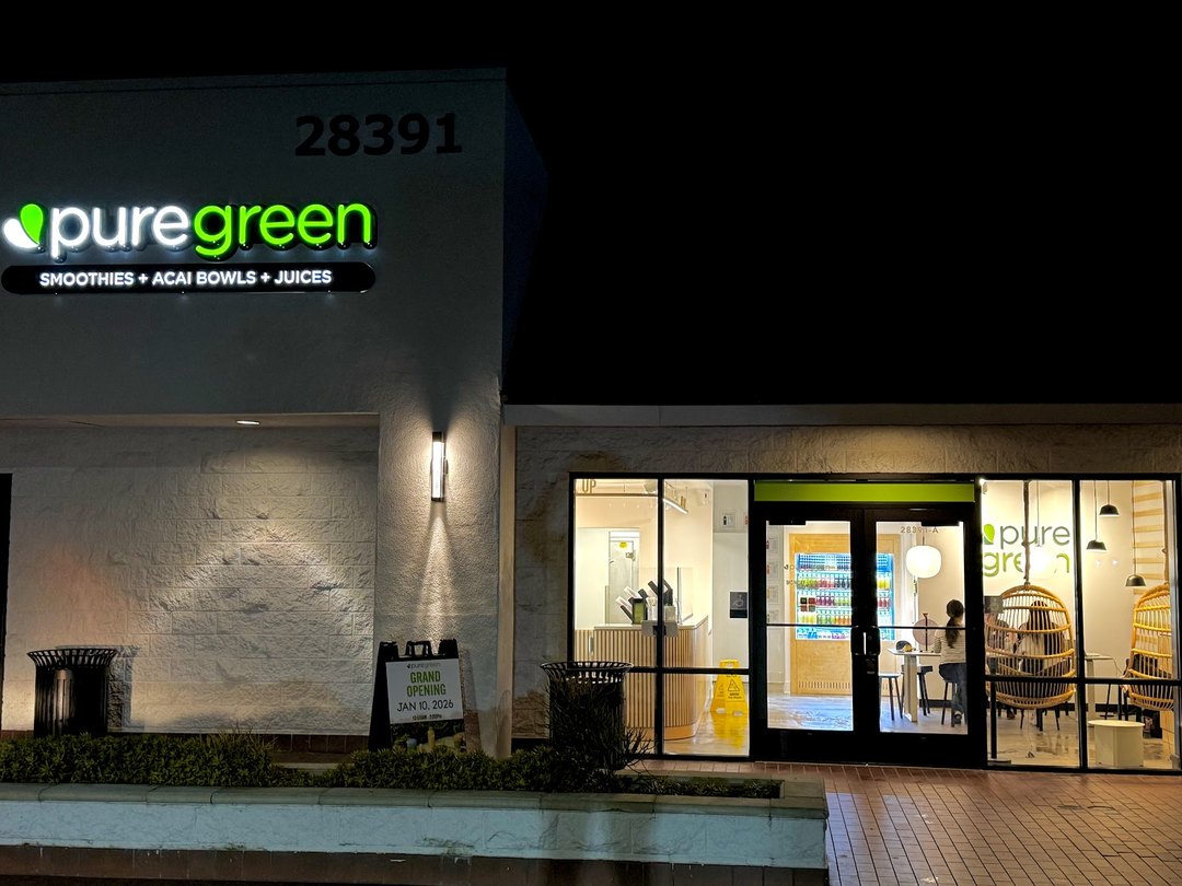 Pure Green Mission Viejo storefront lit up in the evening