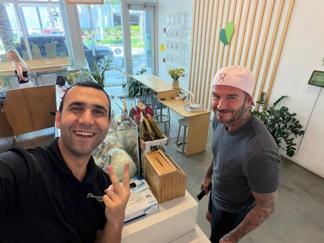 Pure Green Sunset Harbour team welcoming a guest inside the store