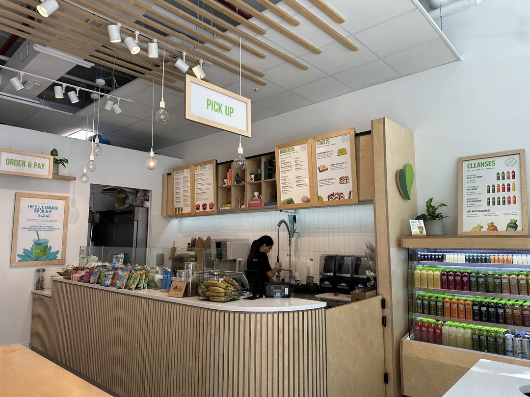 Order and pickup counter with the menu boards inside Pure Green Sunset Harbour