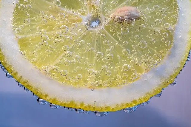 slice of lemon superfoods in pure green juices and smoothies
