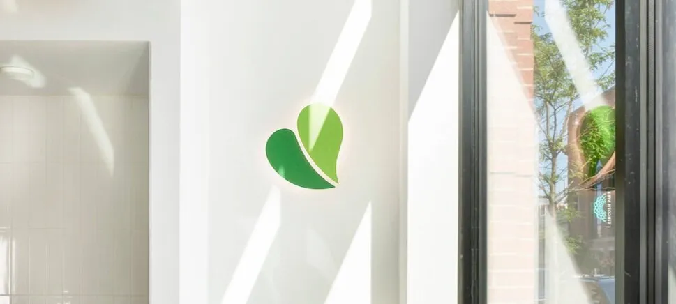 pure green franchise inside of the store logo