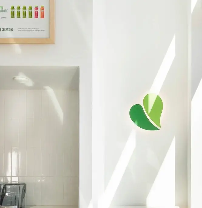 pure green franchise logo on the wall