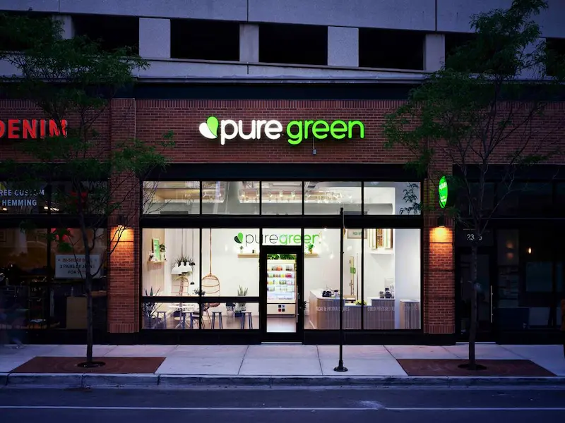 Pure Green Fulton Market storefront on W Fulton Market Street in Chicago at dusk